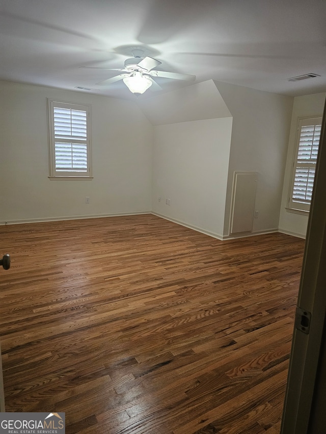 empty room featuring ceiling fan and dark hardwood / wood-style floors