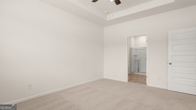 unfurnished bedroom with a closet, ceiling fan, and light colored carpet