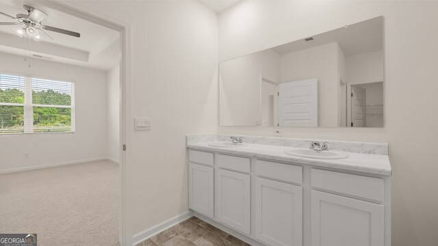 bathroom featuring ceiling fan and vanity