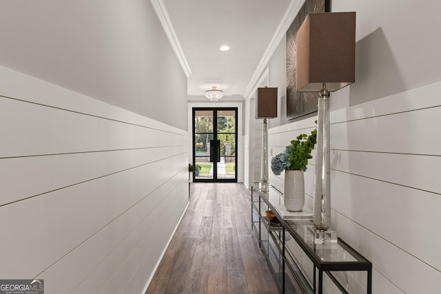 hallway featuring crown molding and dark hardwood / wood-style flooring