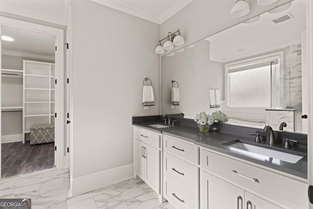 bathroom with vanity and ornamental molding