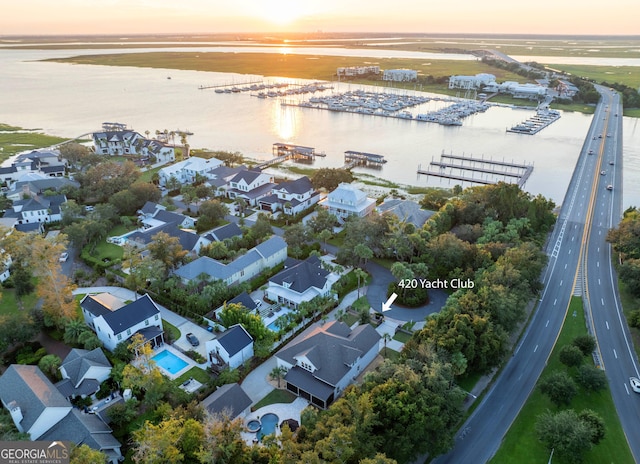 aerial view at dusk with a water view