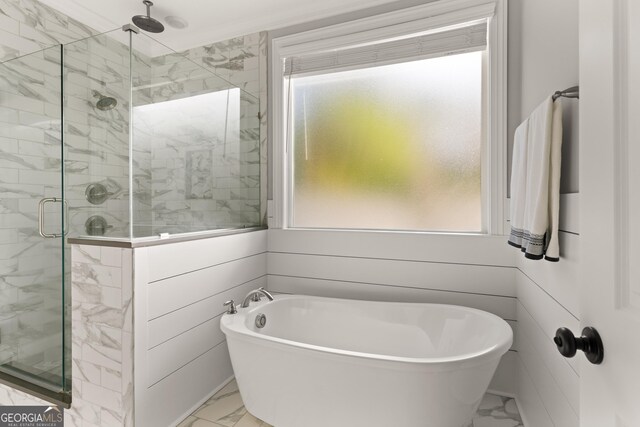 bathroom featuring shower with separate bathtub