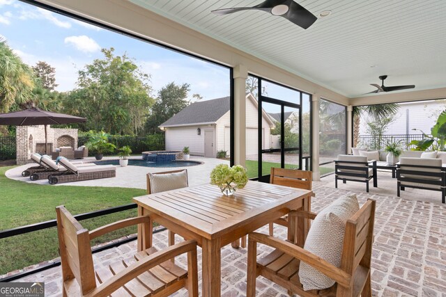 sunroom / solarium with ceiling fan