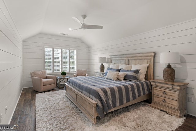 bedroom with ceiling fan, lofted ceiling, and hardwood / wood-style floors