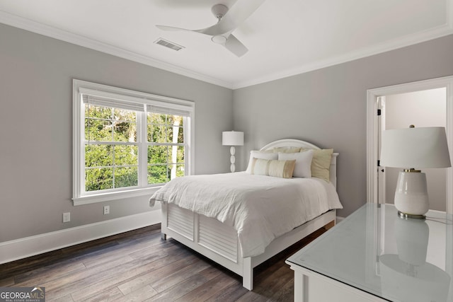 bedroom with ceiling fan, ornamental molding, and dark hardwood / wood-style flooring