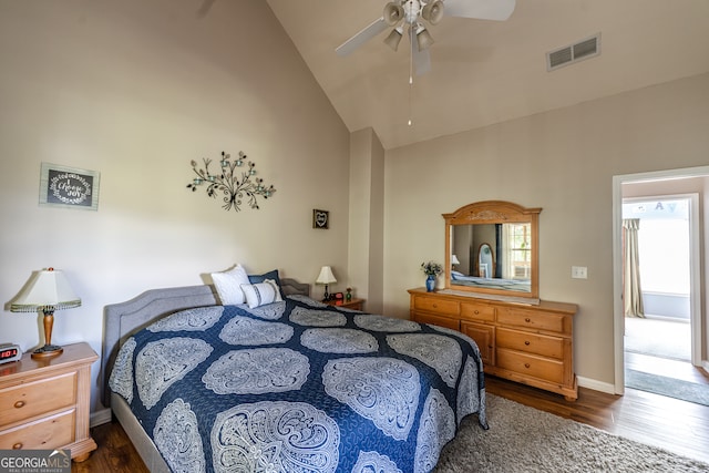 bedroom with high vaulted ceiling, ceiling fan, and dark wood-type flooring