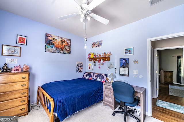 bedroom with light hardwood / wood-style flooring and ceiling fan