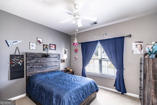 bedroom with ceiling fan and carpet