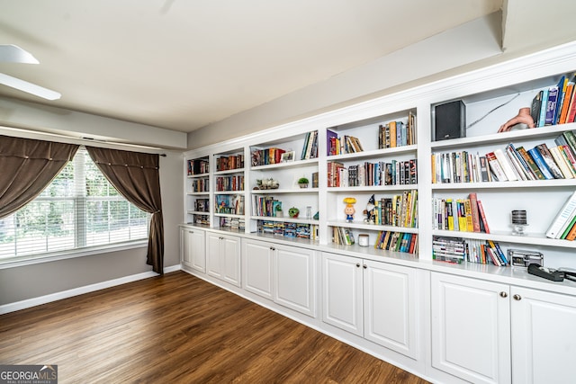 unfurnished room featuring dark wood-type flooring