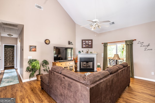 living room featuring ceiling fan, high vaulted ceiling, and hardwood / wood-style flooring