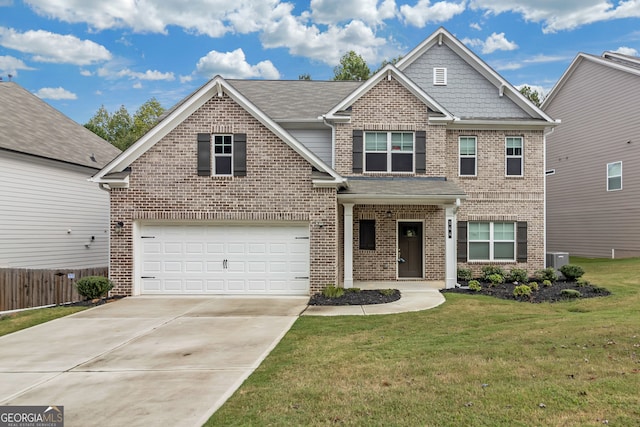 view of front of home with a front yard and a garage