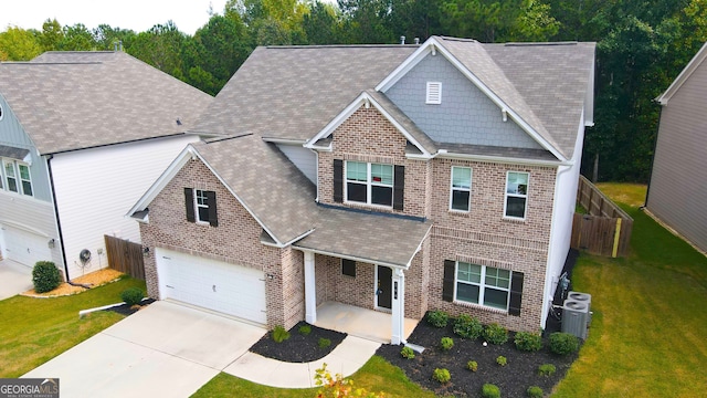 view of front facade featuring a garage and a front lawn