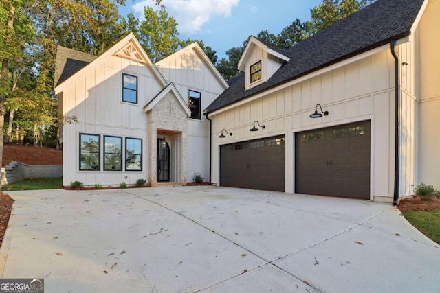 modern farmhouse featuring a garage