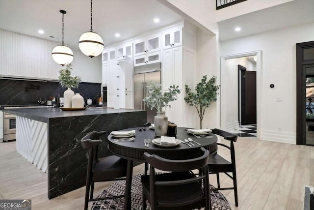 dining space featuring light hardwood / wood-style floors