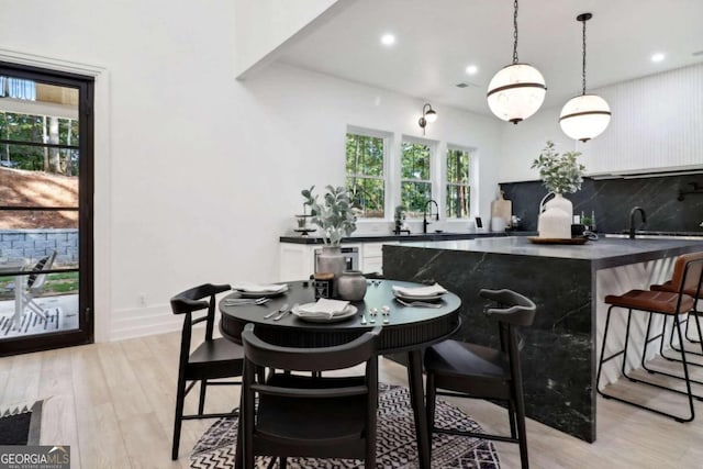 dining room featuring light hardwood / wood-style floors and sink