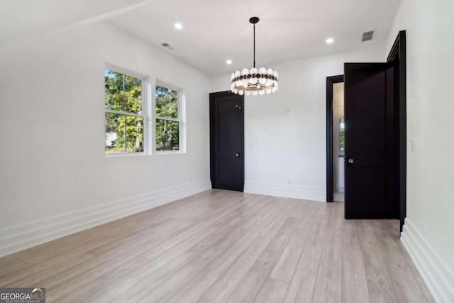 unfurnished dining area with light hardwood / wood-style floors