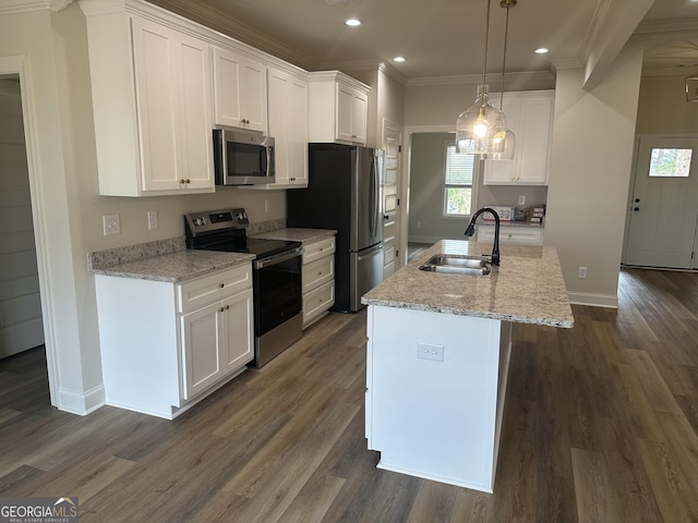 kitchen featuring white cabinetry, sink, an island with sink, and stainless steel appliances