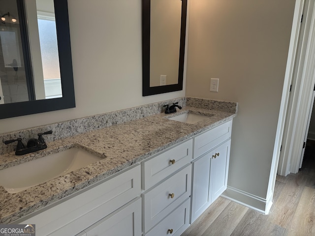 bathroom featuring vanity and hardwood / wood-style flooring