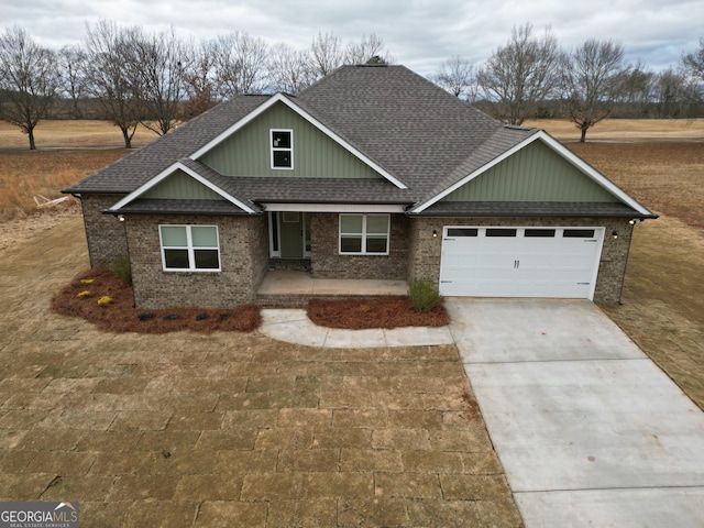 craftsman house with a garage and a front yard