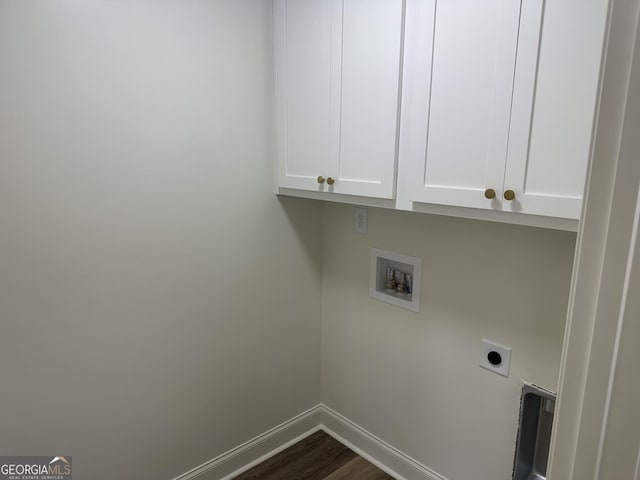 laundry room featuring hookup for an electric dryer, dark hardwood / wood-style floors, cabinets, and hookup for a washing machine