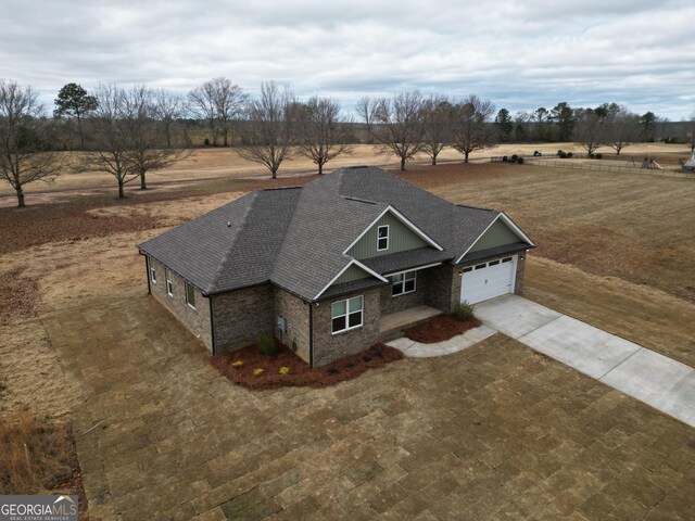 birds eye view of property featuring a rural view