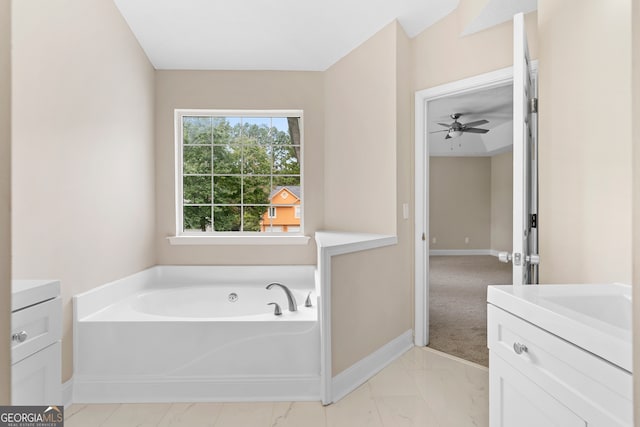 bathroom featuring a tub to relax in, vanity, and ceiling fan