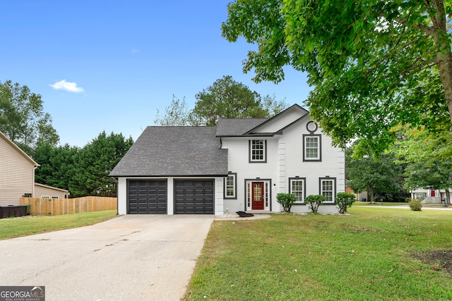 view of front of property with a front yard, a garage, and central air condition unit