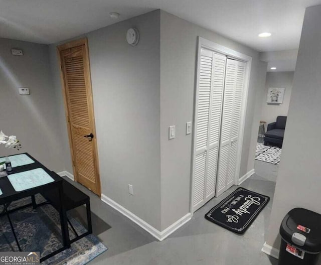 hallway featuring concrete flooring