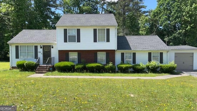 view of front facade with a front lawn and a garage