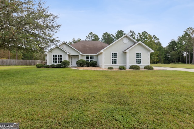 ranch-style house with a front lawn