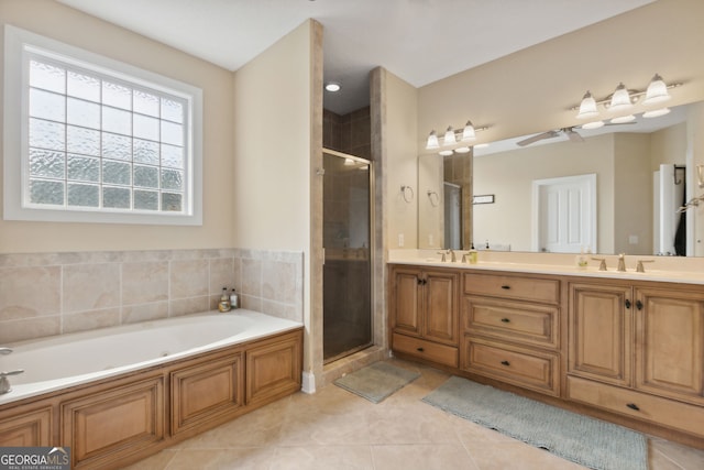 bathroom featuring tile patterned floors, independent shower and bath, and vanity