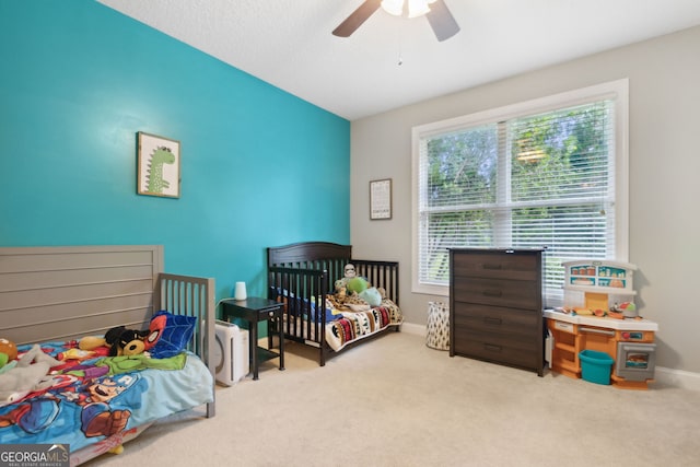 carpeted bedroom featuring ceiling fan