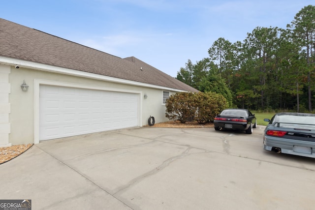 view of property exterior featuring a garage