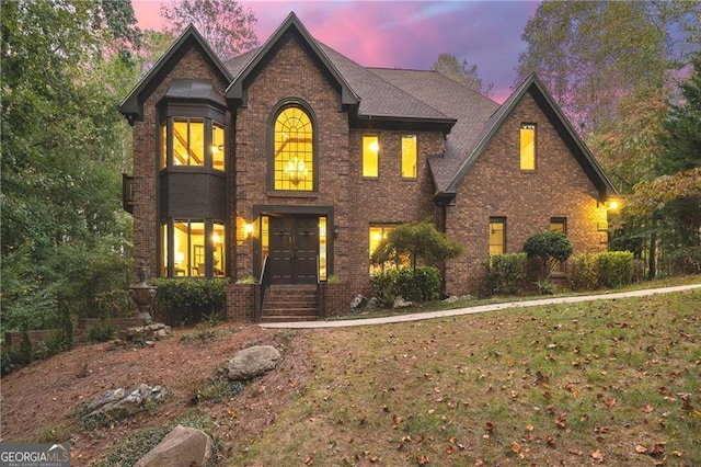 view of front of house with a lawn