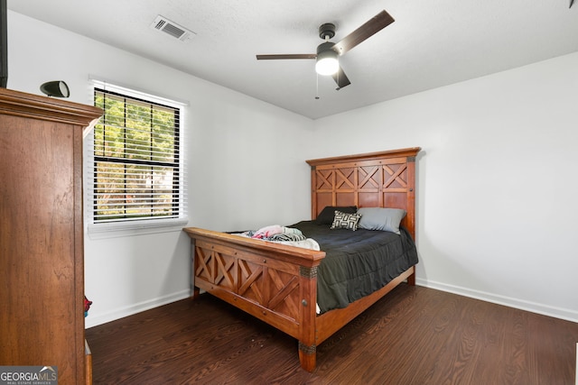 bedroom featuring dark hardwood / wood-style floors and ceiling fan