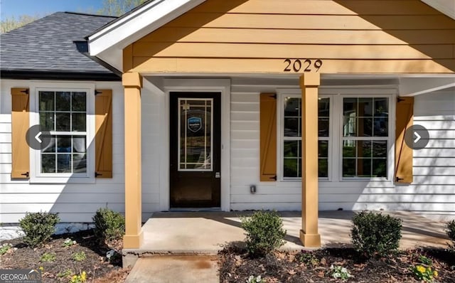 property entrance featuring covered porch