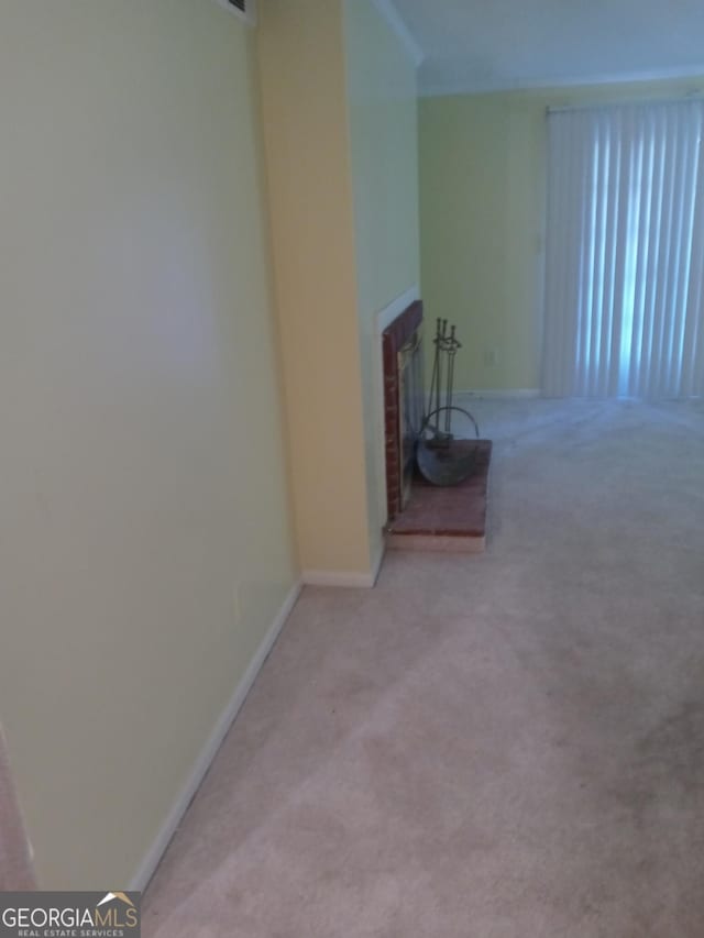 unfurnished living room featuring carpet flooring