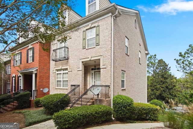 multi unit property featuring a balcony