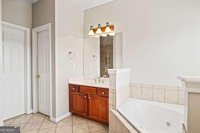 bathroom featuring vanity, shower with separate bathtub, and tile patterned flooring