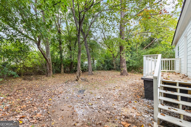 view of yard featuring a wooden deck