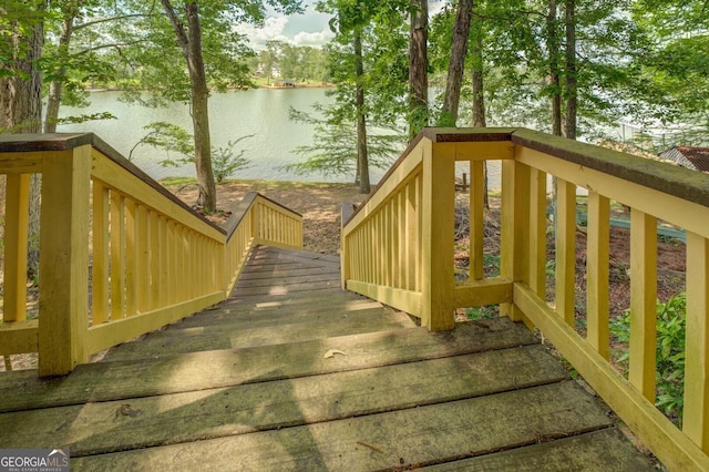 wooden terrace with a water view