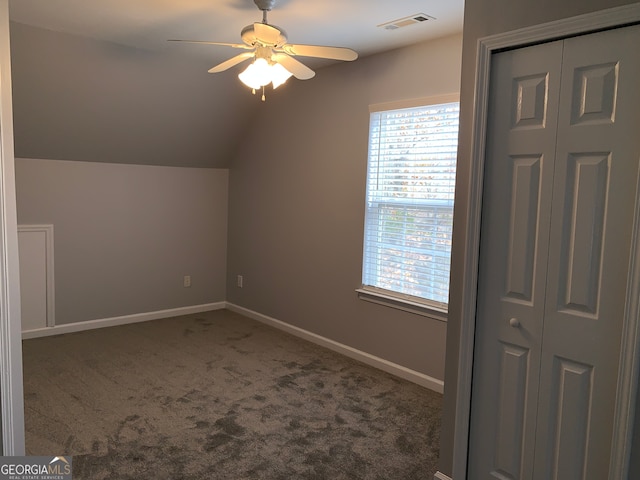 bonus room with vaulted ceiling, ceiling fan, and carpet floors