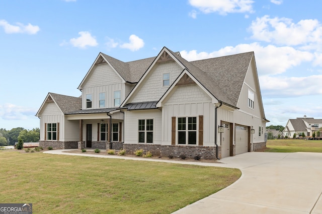 craftsman-style house with a garage and a front lawn