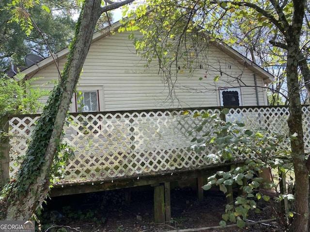 view of side of home featuring a deck