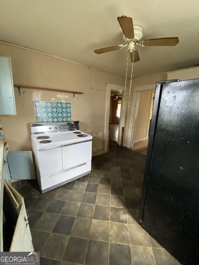 kitchen with white cabinets, electric stove, ceiling fan, and black fridge