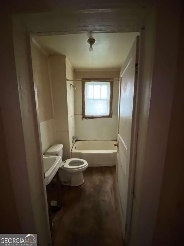 bathroom with shower / bath combination and toilet