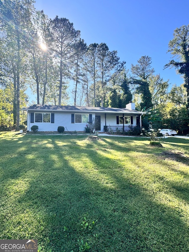 ranch-style home with a front lawn