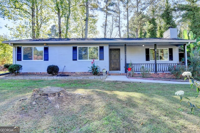 ranch-style house featuring a porch and a front lawn