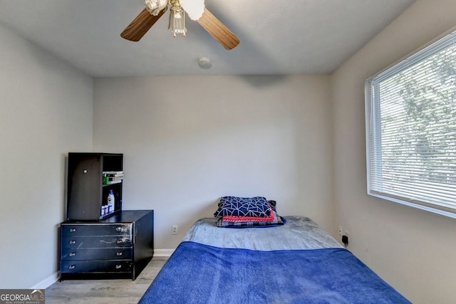 bedroom featuring light hardwood / wood-style floors and ceiling fan